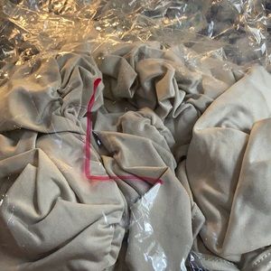 A gray tank top and leggings